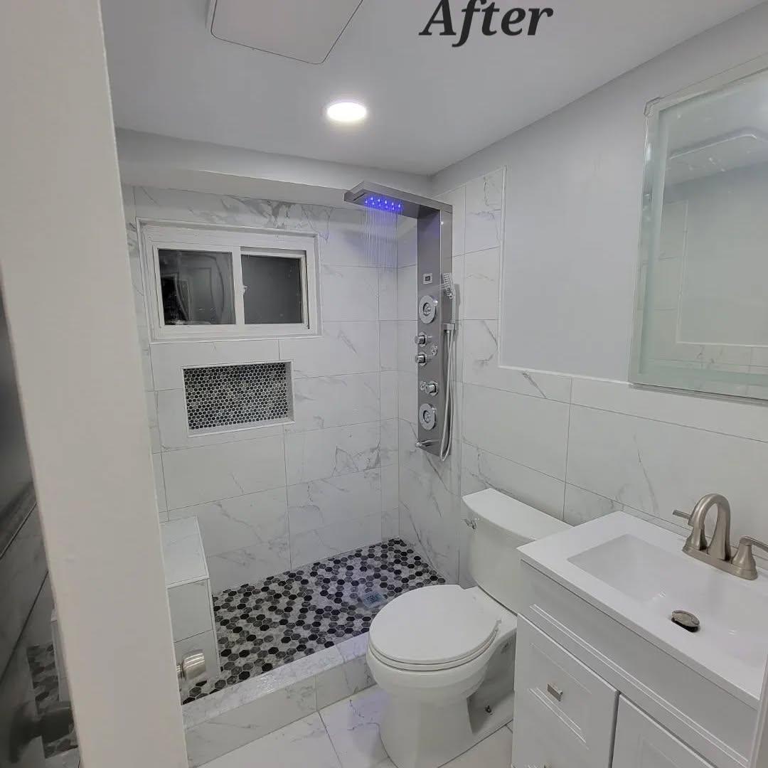 Bathroom renovation after - luxury finished bathroom with marble tiles and premium fixtures